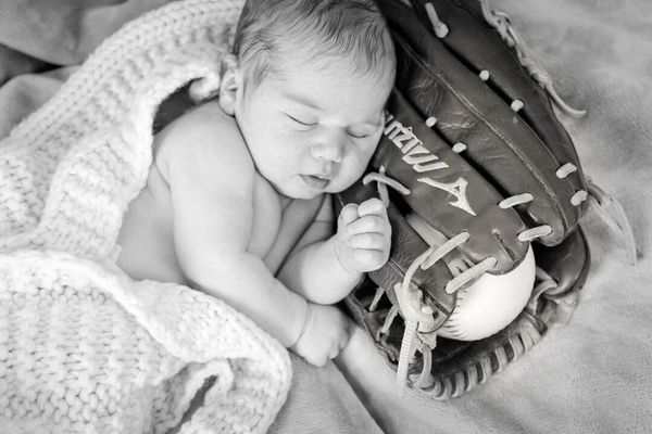 Baby portrait with a baseball theme