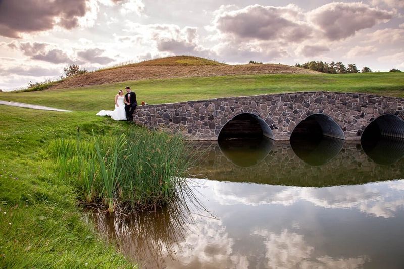 Couple on a bridge on their wedding day